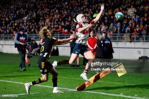 Mac Grealy of the Reds loses the ball over the sideline during the round 12 Super Rugby Pacific match between Chiefs and Queensland Reds at Yarrow...