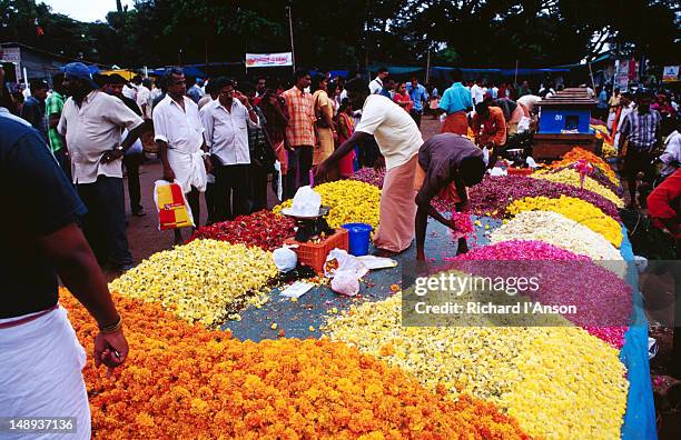 flowers for sale at street market on the eve of the onam festival. - onam bildbanksfoton och bilder