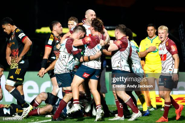 The Reds celebrate after winning the round 12 Super Rugby Pacific match between Chiefs and Queensland Reds at Yarrow Stadium, on May 12 in New...