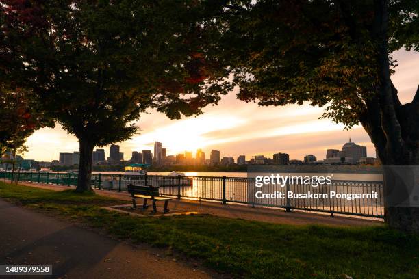 boston skyline in autumn viewed from across the river in massachusetts, usa. - ma stock pictures, royalty-free photos & images