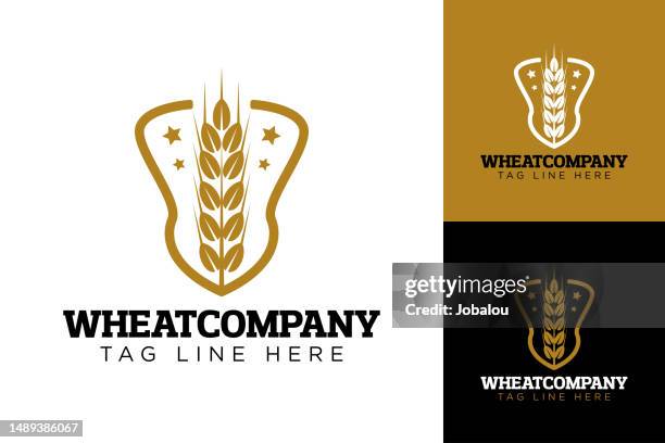 golden badge with wheat on shield brand template - wheat beer stock illustrations