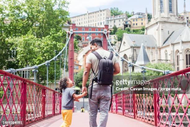 father with his daughter for a walk and playing - auvergne rhône alpes stock pictures, royalty-free photos & images