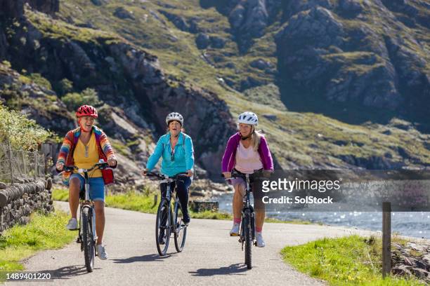 senior women having the best day - active seniors biking stock pictures, royalty-free photos & images