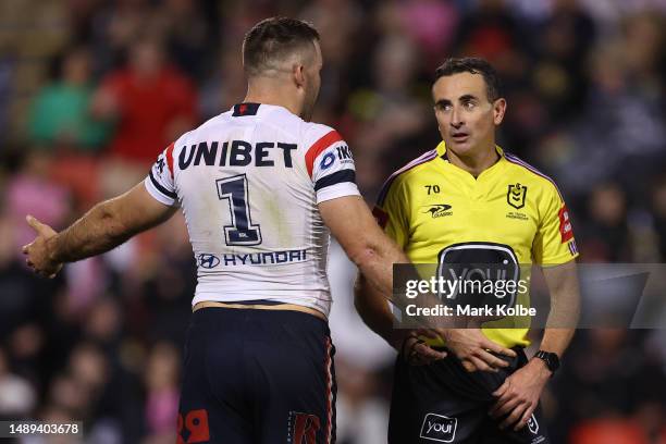 Referee Gerard Sutton speaks to James Tedesco of the Roosters during the round 11 NRL match between the Penrith Panthers and Sydney Roosters at...