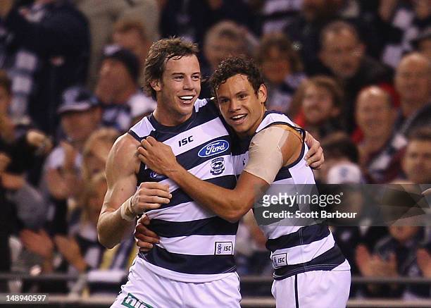 Josh Walker of the Cats celebrates after kicking a goal during the round 17 AFL match between the Geelong Cats and the Essendon Bombers at Etihad...