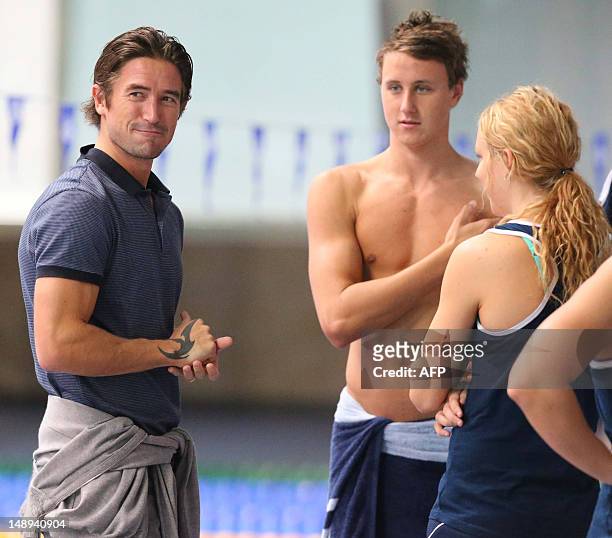 Australian footballer Harry Kewell meets members of the Australian Olympic swimming squad during a training session ahead of the London 2012 Olympic...