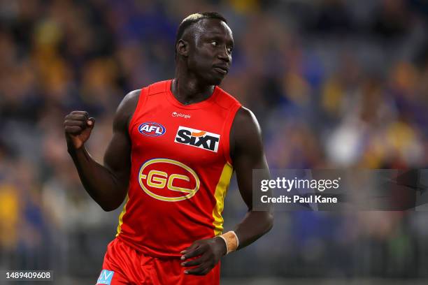 Mabior Chol of the Suns celebrates a goal during the round nine AFL match between West Coast Eagles and Gold Coast Suns at Optus Stadium, on May 12...