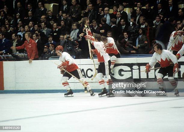 Paul Henderson, Jean Ratelle and Yvan Cournoyer of Canada celebrate on the ice during the 1972 Summit Series against the Soviet Union in September,...