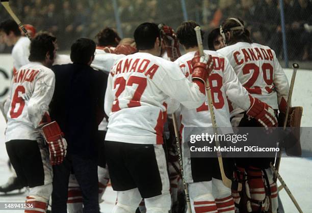 Paul Henderson of Canada is surrounded by celebrating teammates after scoring the series-winning goal during Game 8 of the 1972 Summit Series between...