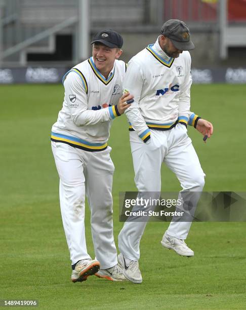 Yorkshire player Dom Bess congratulates Adam Lyth after he had caught out Scott Borthwick off the bowling of Mattew Fisher during day 2 of the LV=...