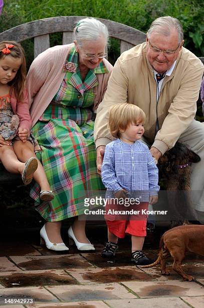 Princess Isabella, Queen Margrethe II., Prince Consort Henrik of Denmark and Prince Vincent Frederik Minik Alexander pose during a photocall for the...