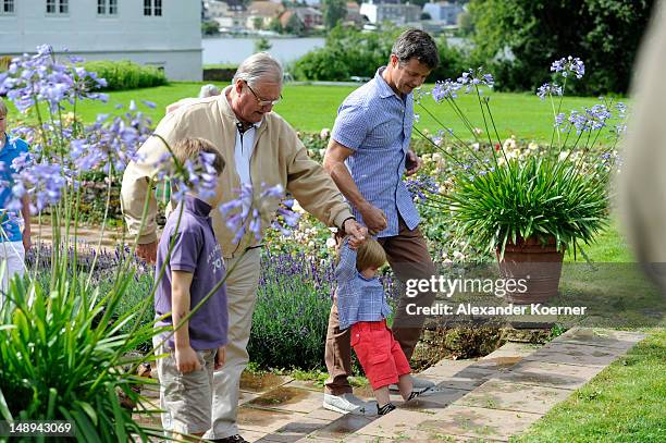 Prince Consort Henrik of Denmark, Crown Prince Frederik and Prince Vincent Frederik Minik Alexander pose during a photocall for the Royal Danish...