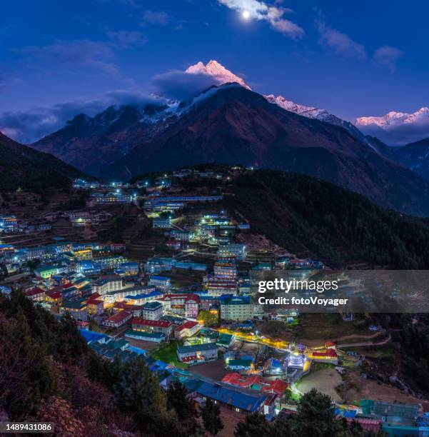 moonrise over namche bazaar alpenglow on thamserku himalayan mountains nepal - namche bazaar stock pictures, royalty-free photos & images