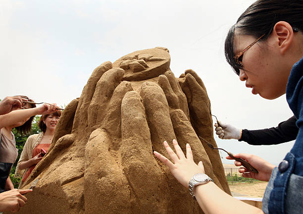 JPN: Sand Museum Exhibits London 2012 Olympic Logo Sculptures