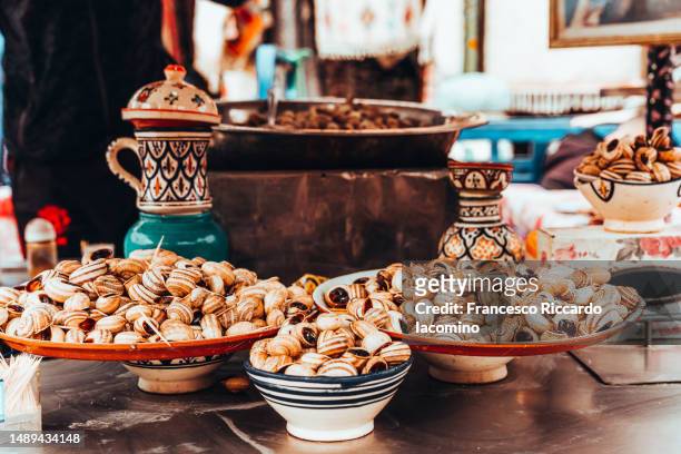 small snails ready to eat, marrakech - snail stock pictures, royalty-free photos & images