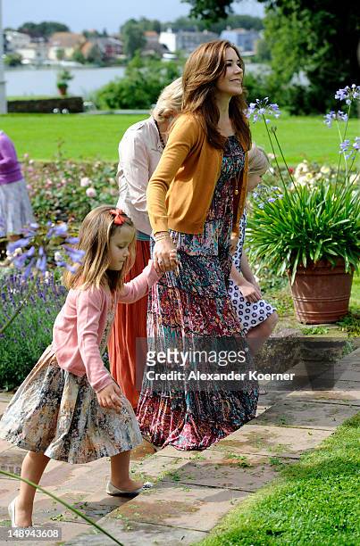 Crown Princess Mary and Princess Isabella pose during a photocall for the Royal Danish family at their summer residence of Grasten Slot on July 20,...