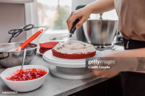 close up of red velvet cake baking - decorating a cake stock pictures, royalty-free photos & images