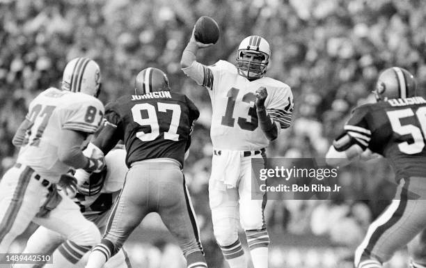 Miami Dolphins QB Dan Marino looks downfield to TE Dan Johnson during game action at Super Bowl XIX of Miami Dolphins vs. San Francisco 49ers,...