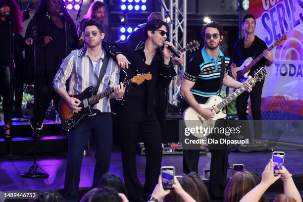 Nick Jonas, Joe Jonas, and Kevin Jonas of the Jonas Brothers perform on NBC's "Today" at Rockefeller Plaza on May 12, 2023 in New York City.