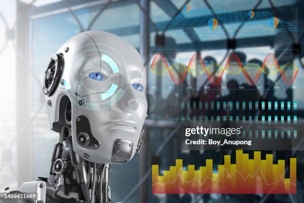 artificial intelligence robot while analyzing data chart. - photography icon stock pictures, royalty-free photos & images