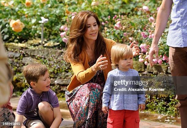 Prince Christian, Princess Mary of Denmark and Prince Vincent Frederik Minik Alexander pose during a photocall for the Royal Danish family at their...