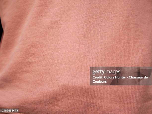 close-up of a faded pink cotton sweater  in paris, france - industrie de la mode stock-fotos und bilder