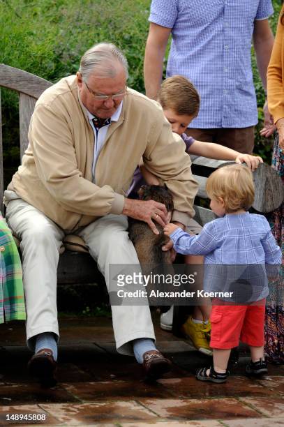 Prince Consort Henrik of Denmark and Prince Vincent Frederik Minik Alexander of Denmarkn pose during a photocall for the Royal Danish family at their...