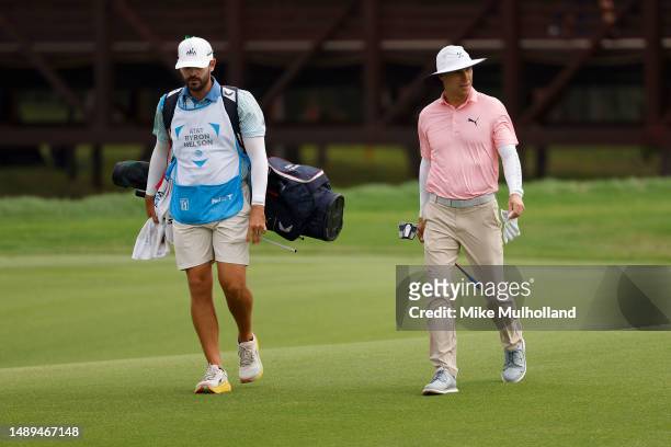 Ben Crane of the United States walks the ninth hole with his caddie during the second round of the AT&T Byron Nelson at TPC Craig Ranch on May 12,...