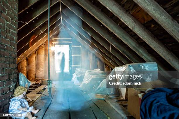 paranormal ghost caught on camera in creepy attic - attic storage stock pictures, royalty-free photos & images