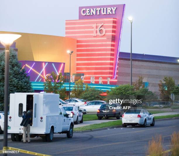 Police cars in front of the Century 16 theater in Aurora, Colorado where a gunman opened fire during the opening of the new Batman movie "The Dark...