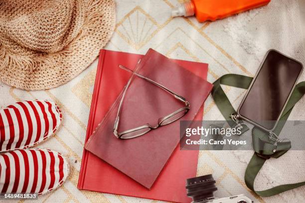 top  down image beach accesories and book - beach flat lay stock pictures, royalty-free photos & images