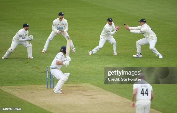 Yorkshire batsman Adam Lyth is caught first ball for 0 by David Bedingham at slip, via a deflection from Alex Lees off the bowling of Ben Raine...