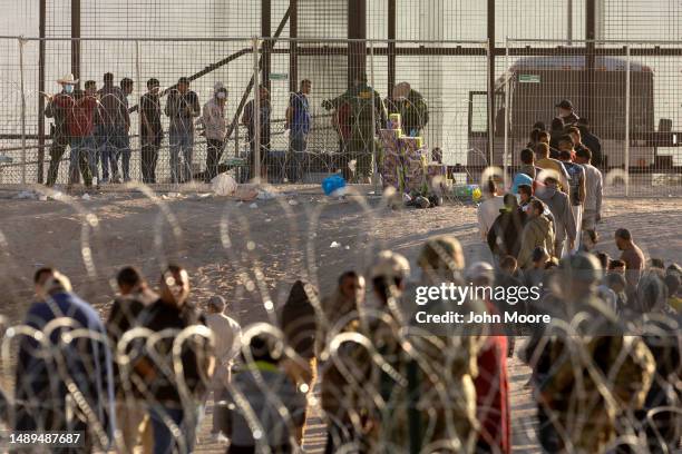 Immigrants wait to be transported and processed by U.S. Border Patrol agents at the U.S.-Mexico border on May 12, 2023 in El Paso, Texas. The U.S....