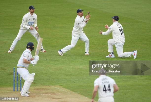 Yorkshire batsman Adam Lyth is caught first ball for 0 by David Bedingham at slip, via a deflection from Alex Lees off the bowling of Ben Raine...