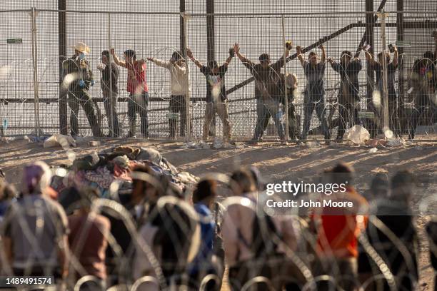 Border Patrol agent body searches immigrants at the U.S.-Mexico border on May 12, 2023 in El Paso, Texas. The U.S. Covid-era Title 42 immigration...