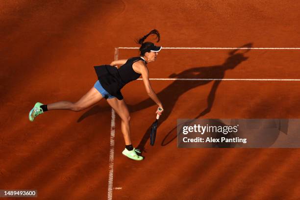 Sorana Cirstea of Romania serves in her women's singles second round match against Jelena Ostapenko of Latvia during day five of the Internazionali...