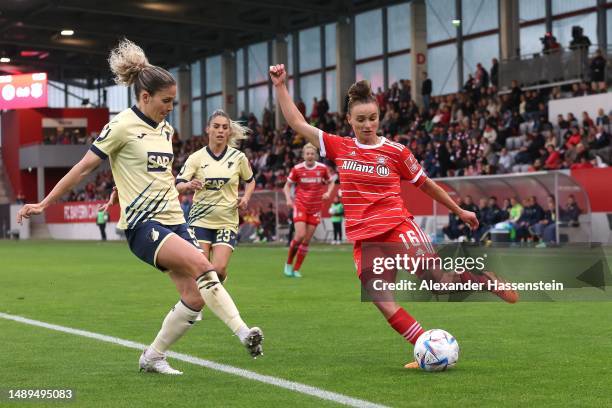 Lina Magull of München battles for the ball with Luana Chiara Bühler of Hoffenheim (L during the FLYERALARM Frauen-Bundesliga match between FC Bayern...