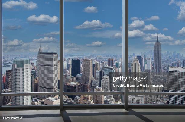 new york. modern window over manhattan - central park manhattan photos et images de collection