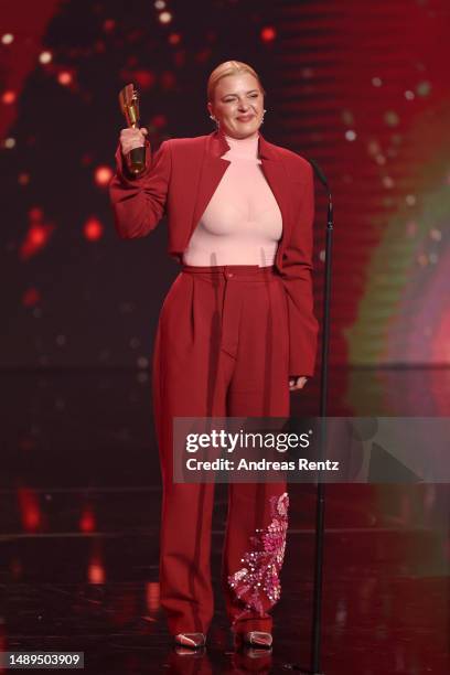 Jördis Triebel receives the Best Supporting Actress Award on stage during the 73rd Lola - German Film Award show at Theater am Potsdamer Platz on May...