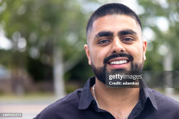 portrait of a handsome young indian man - indian woman short hair stock pictures, royalty-free photos & images