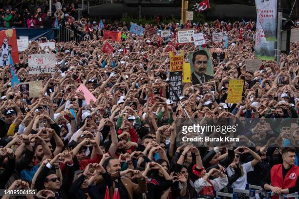 Supporters gesture and chant slogans while waiting for the arrival of CHP Party presidential candidate Kemal Kilicdaroglu during a campaign rally on...