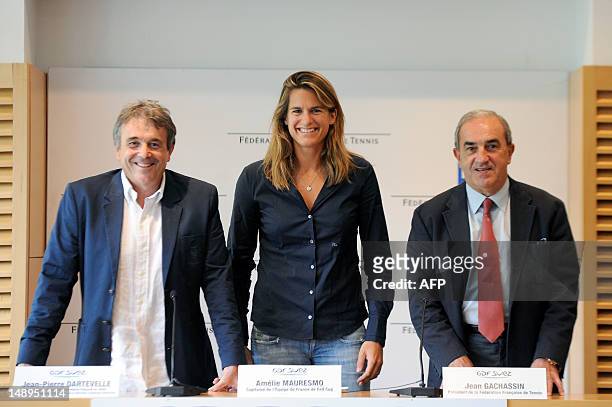 Former world number one Amelie Mauresmo poses near the French Tennis Federation president Jean Gachassin and vice-president Jean-Pierre Dartevelle on...