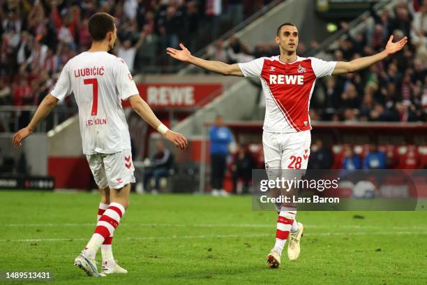 Ellyes Skhiri of FC Koln celebrates scoring his teams third goal of the game with teammate Dejan Ljubicic during the Bundesliga match between 1. FC...