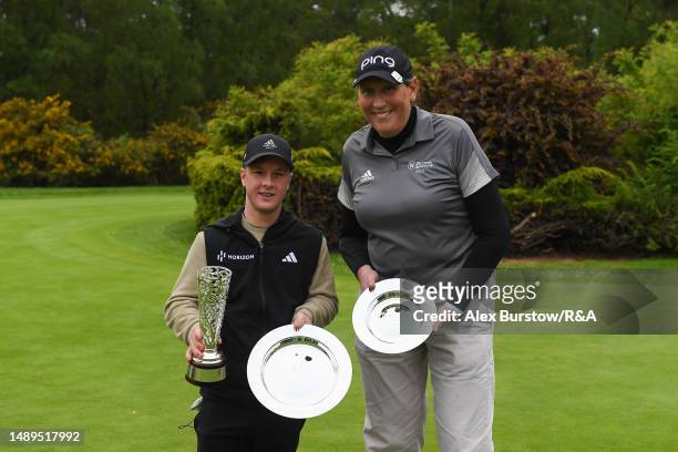 Overall and ST3 Class winner, Brendan Lawlor of Ireland and leading female winner, Kim Moore of The United States pose for a photo with their...