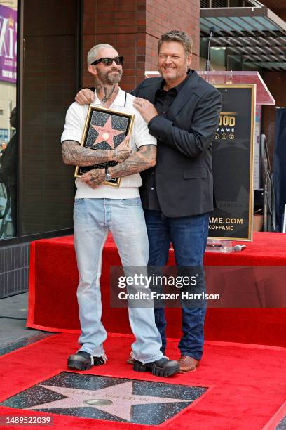 Adam Levine and Blake Shelton attend Blake Shelton's Star Ceremony on The Hollywood Walk Of Fame on May 12, 2023 in Hollywood, California.