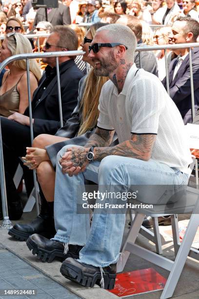 Behati Prinsloo and Adam Levine attend Blake Shelton's Star Ceremony on The Hollywood Walk Of Fame on May 12, 2023 in Hollywood, California.
