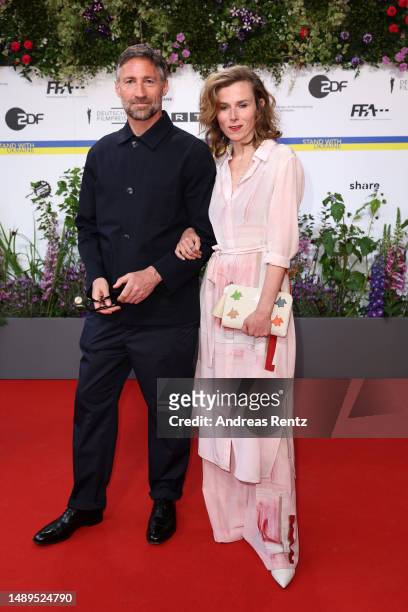 Benjamin Sadler and Karin Hanczewski arrive for the 73rd Lola - German Film Award at Theater am Potsdamer Platz on May 12, 2023 in Berlin, Germany.