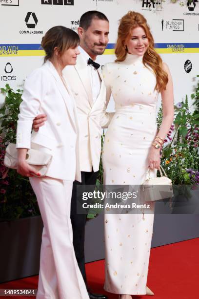 Jeanne Tremsal, Clemens Schick and Palina Rojinski arrive for the 73rd Lola - German Film Award at Theater am Potsdamer Platz on May 12, 2023 in...