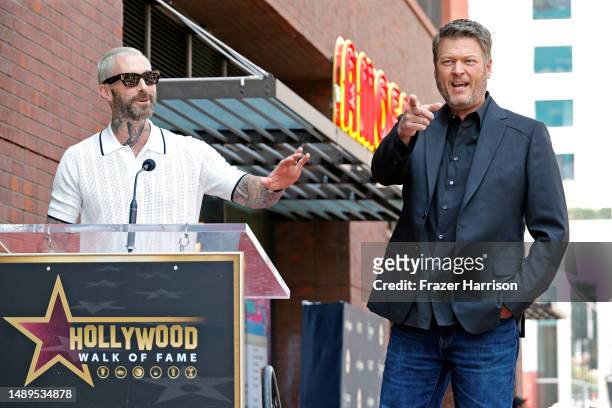 Adam Levine and Blake Shelton speak on stage at Blake Shelton's Star Ceremony on The Hollywood Walk Of Fame on May 12, 2023 in Hollywood, California.