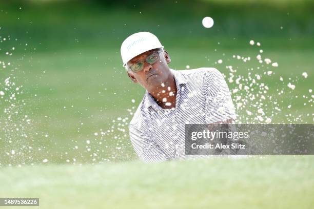 Vijay Singh of Fiji plays out of the greenside bunker on the eighth hole during the second round of the Regions Tradition at Greystone Golf and...